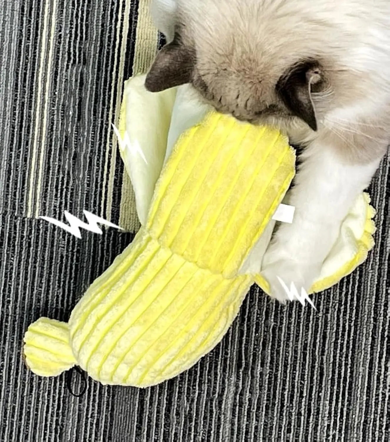 Yellow banana-shaped cat toy with textured surface measuring 13 inches long