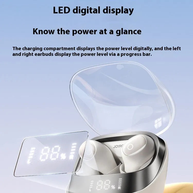Beige wireless in-ear Bluetooth headphones with charging case on a table