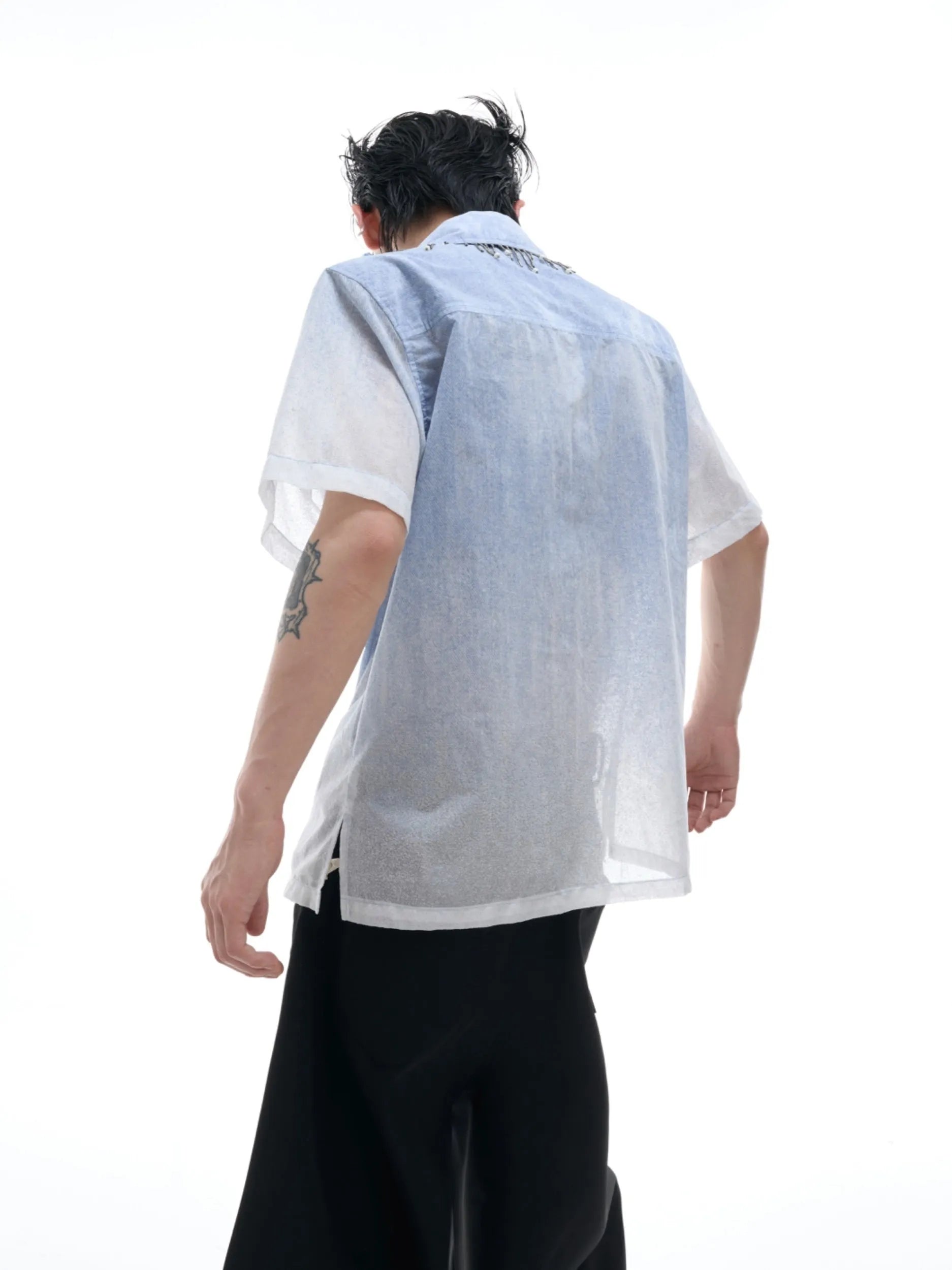 Blue loose fit short sleeve casual shirt on a hanger.