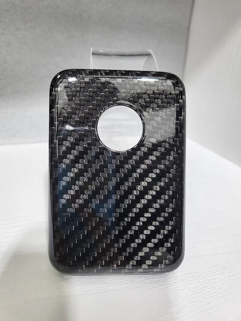 Black Kevlar hard shell case for Apple MagSafe power bank, shown in 3K round hole bright finish.
