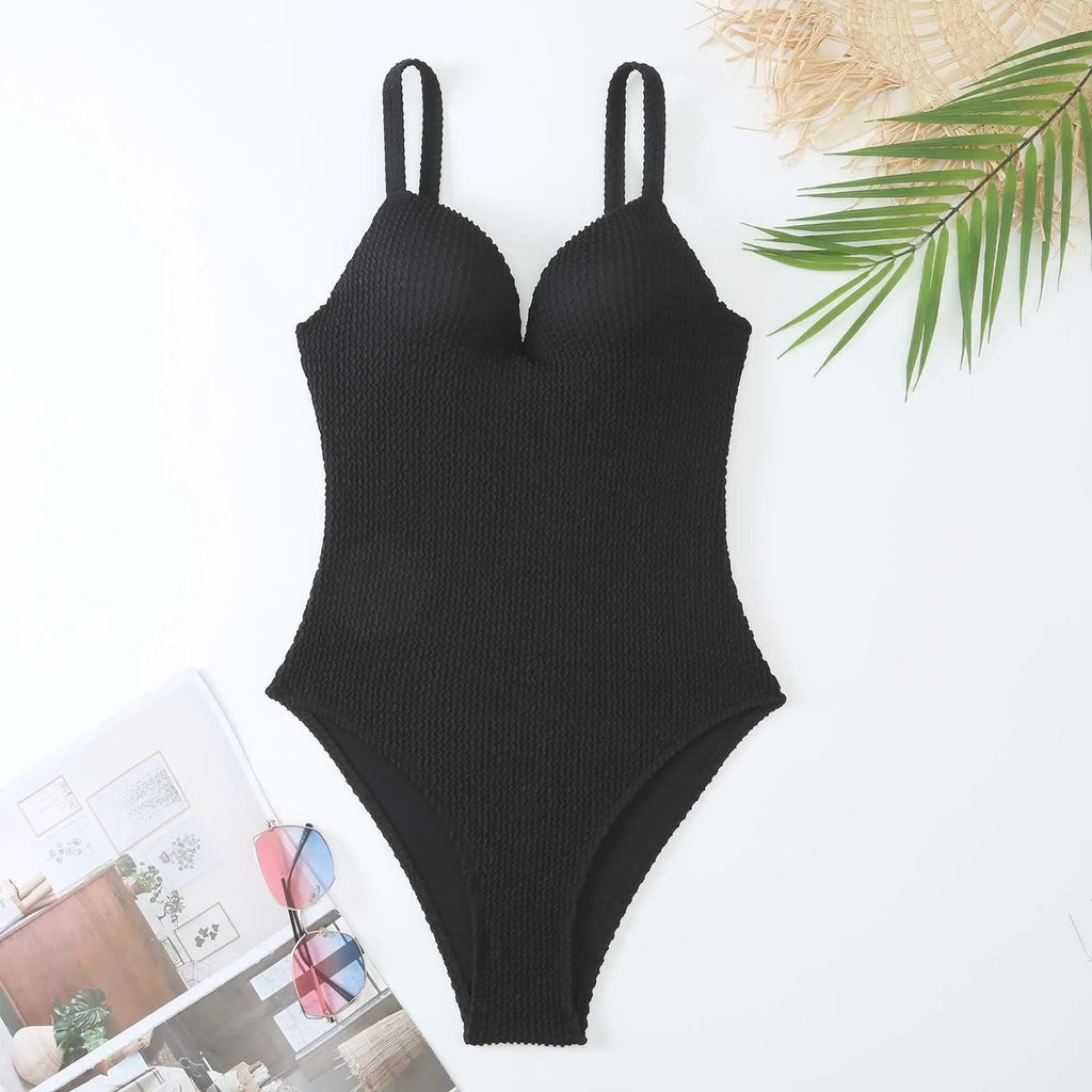 Women's sleeveless one-piece swimsuit in a small sunken stripe pattern, shown in multiple colours.