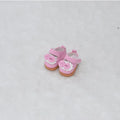 Pair of miniature black boots for a 17cm fashion doll on a white background.