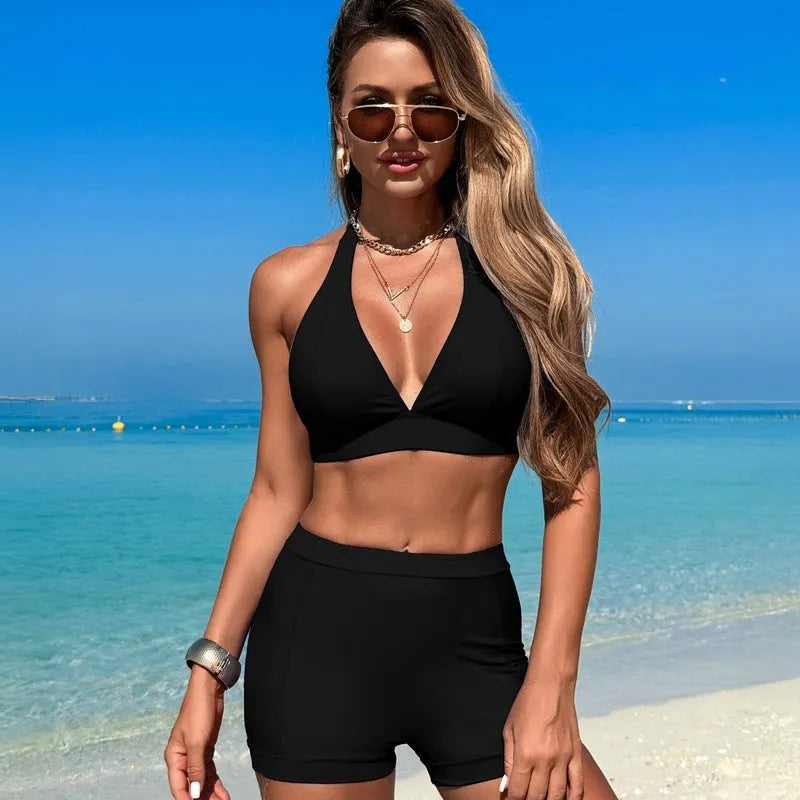 Women's black split bikini swimsuit with adjustable ties, shown on a mannequin.