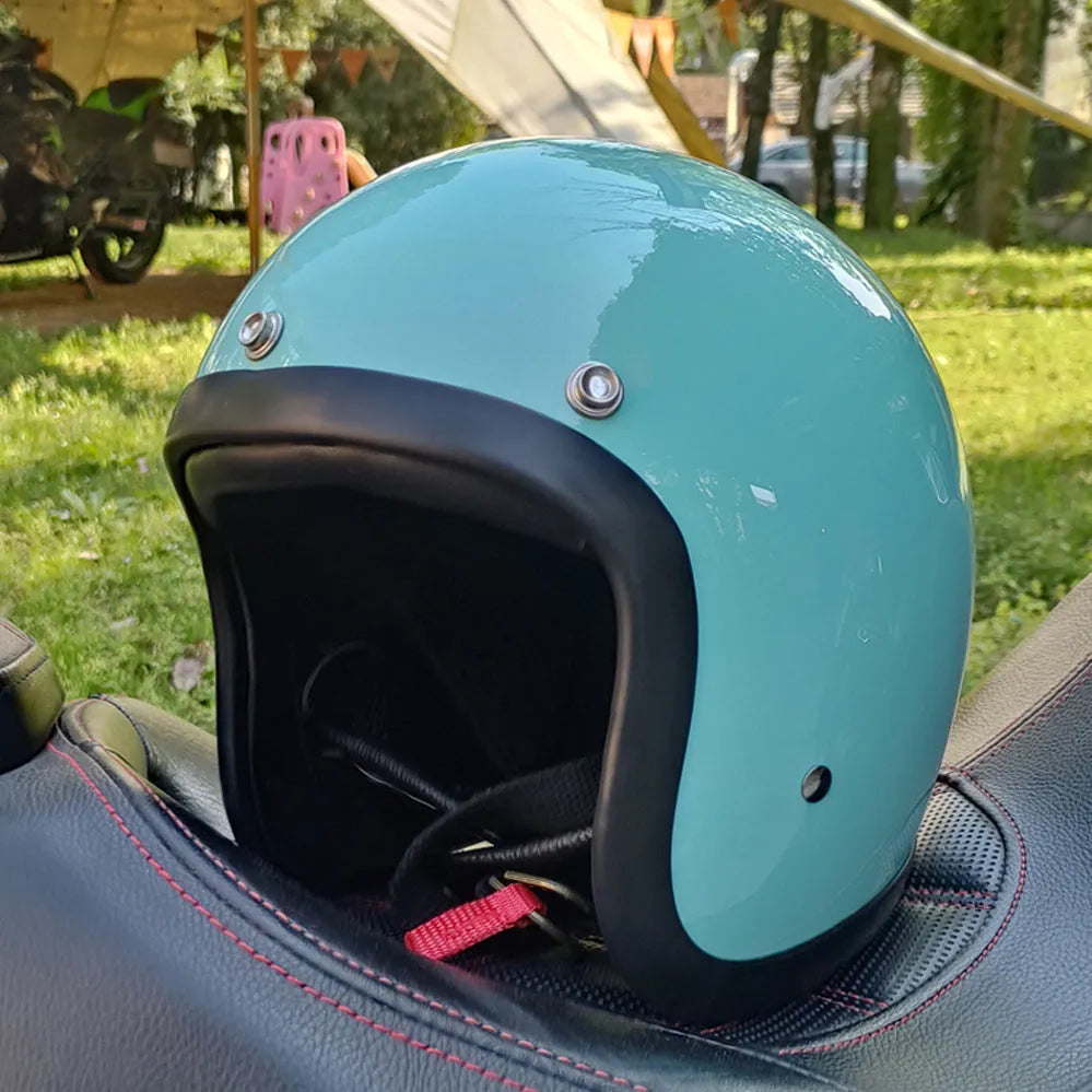 Cement Grey retro open-face motorcycle helmet with clear visor on a plain background.