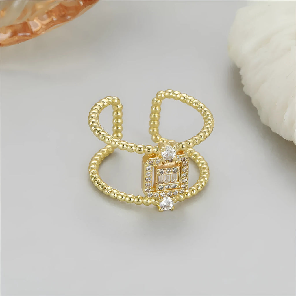 Adjustable open ring with 14K copper-plated gold finish and asymmetric U-shape design