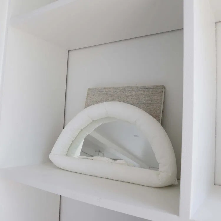 Soft cotton-filled hanging mirror in modern solid colour design