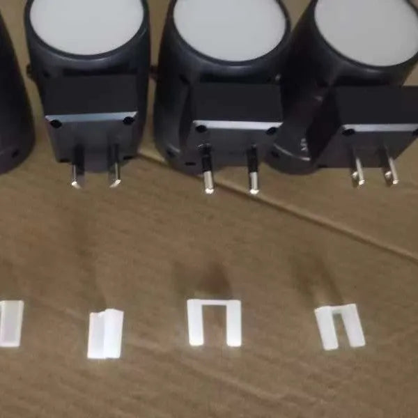 White plug-in night lamp with adjustable brightness control and rotatable light head