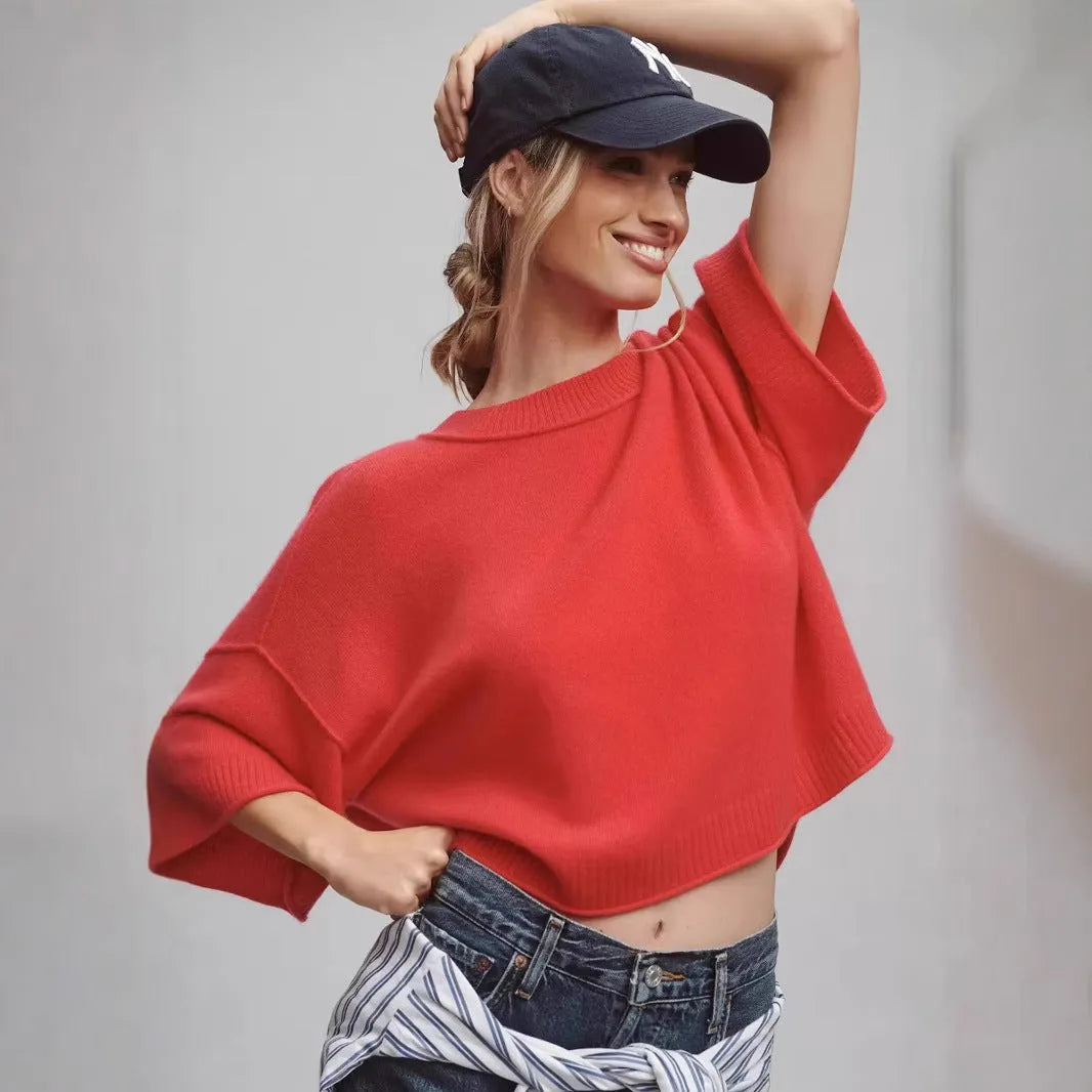Red cropped women's t-shirt with regular sleeves and exposed navel styling on mannequin