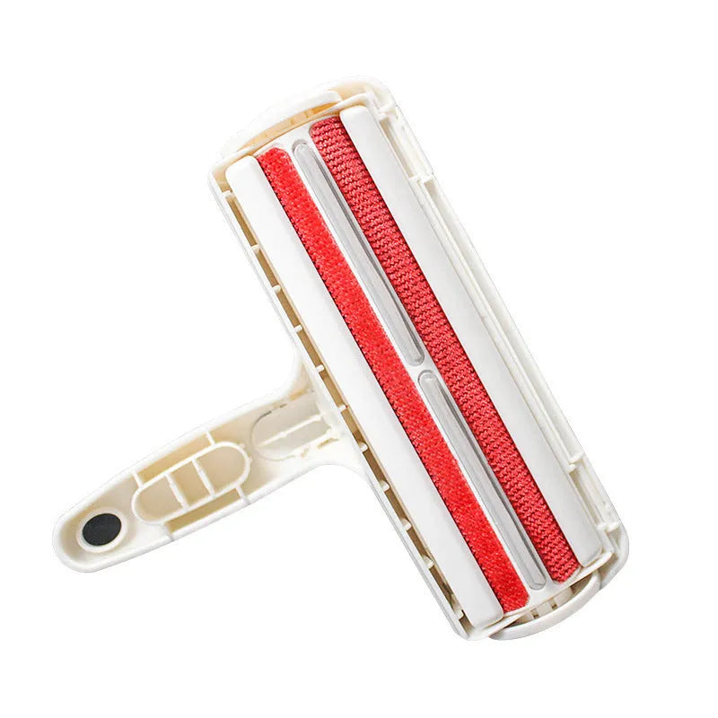 White reusable pet hair remover roller on fabric furniture