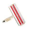 White reusable pet hair remover roller on fabric furniture