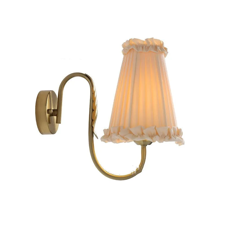 Wheat wall lamp with fabric shade and iron frame mounted on a bedroom wall with warm non-stroboscopic light