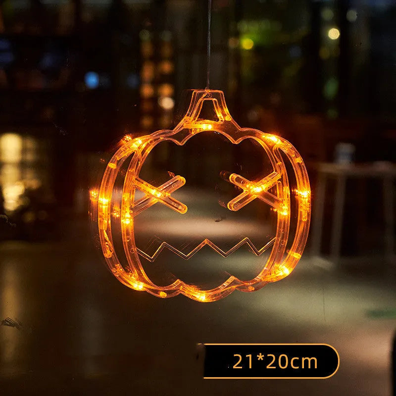 Halloween LED window lights with suction cups showing ghost, spider, and pumpkin decorations
