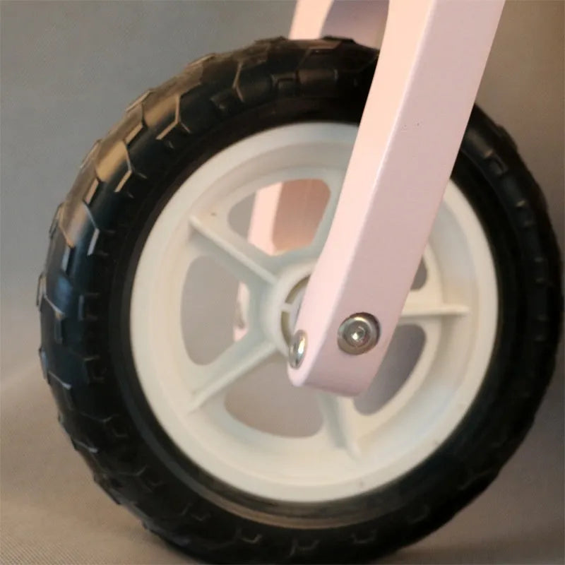 Pink wooden toddler balance scooter with a 10-inch deck for children aged 1-6.