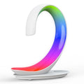 White swan-shaped desktop wireless charger with integrated Bluetooth speaker and colourful LED atmosphere light.