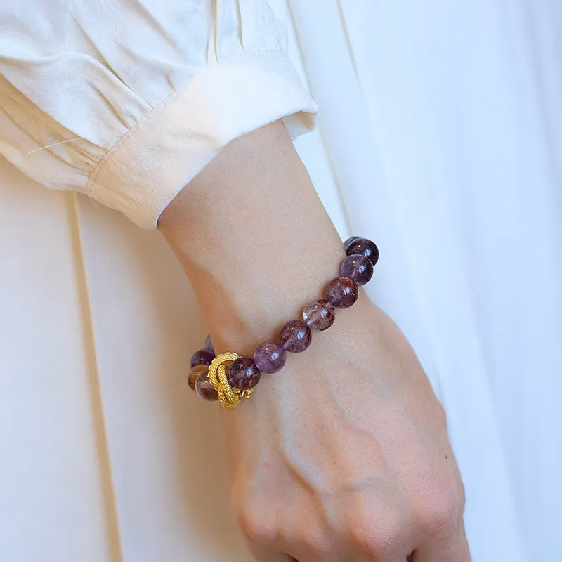 Purple cornucopia bracelet with nine purple crystals and zodiac animal design