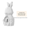 Rabbit-shaped silicone desk charger bracket in white with wrist strap holding a charging cable