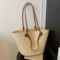 Beige woven shoulder bag with retro styling and dual-carry handles shown in horizontal square suitcase shape
