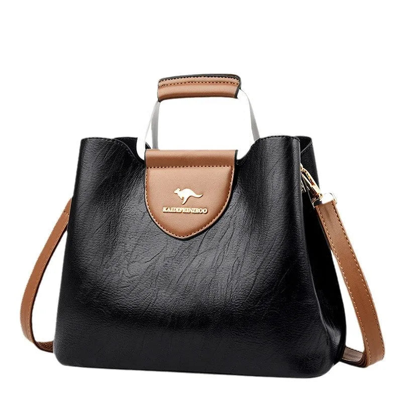 Women's barrel crossbody shoulder bag in soft PU with zip pocket and document pocket, shown in one of six colours