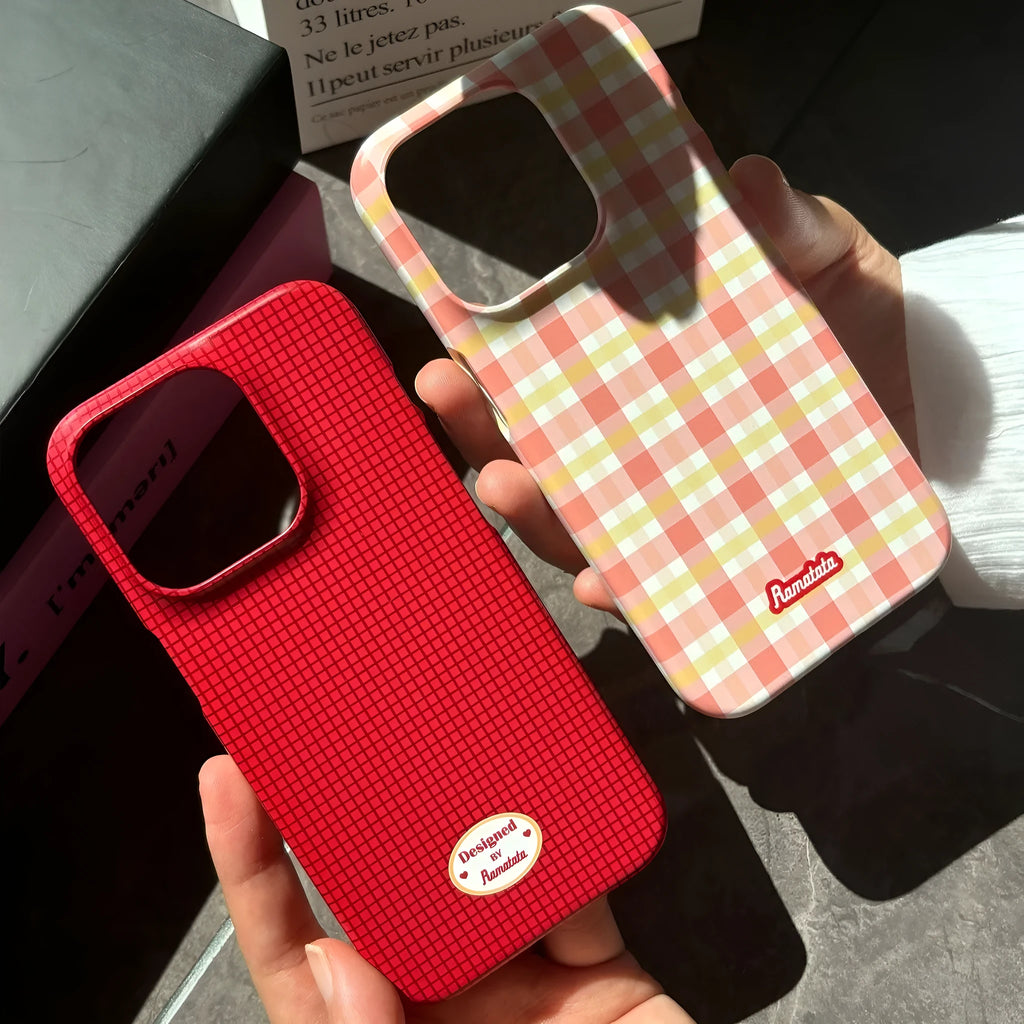 Original plain plaid design iPhone 15 Pro Max case in glossy red grid or frosted orange grid options.