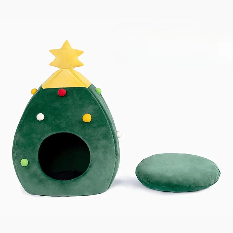 Red Christmas tree shaped cave pet bed with plush interior for a cat or small dog.