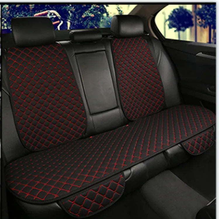 Linen universal car seat cushion in black with decorative red thread pattern on base.