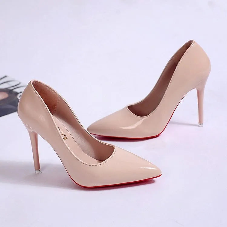 Women's black stiletto heel pump with pointed toe and shallow mouth on a rubber sole.