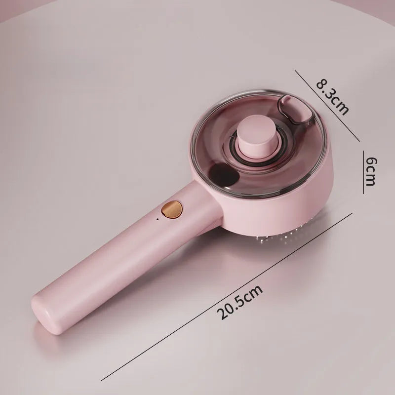 Pink and white cat steam brush with spray tank, stainless steel bent bristles, and a one-click hair removal button.