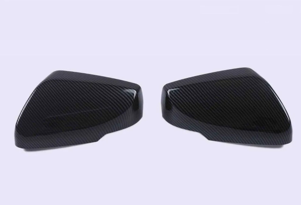 Pair of black ABS rearview mirror covers with carbon fibre pattern for Cadillac CT5 CT6.