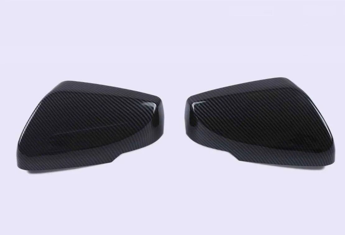 Pair of black ABS rearview mirror covers with carbon fibre pattern for Cadillac CT5 CT6.