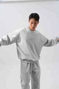Men's black polar fleece winter sports suit with loose fit long sleeve coat and matching trousers