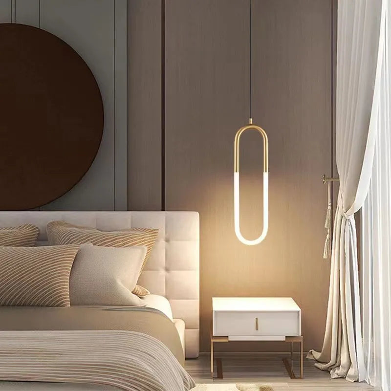 Modern Nordic-style U-shaped pendant chandelier light in a bedroom setting, showing compact 200mm design.