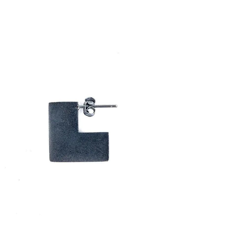 Oxidised black sterling silver square geometric earrings on a white background.