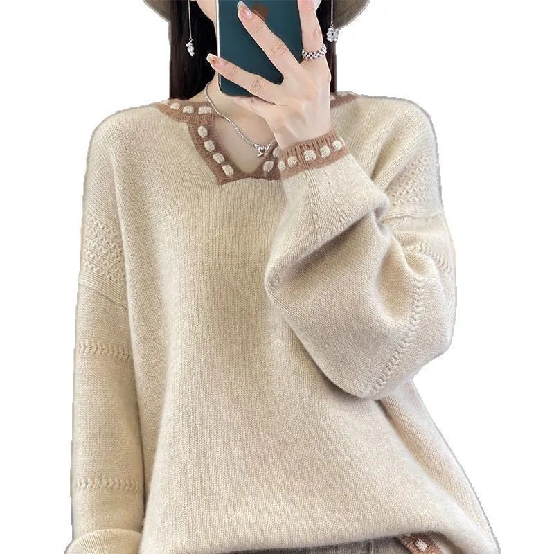 Women's camel V-neck viscose sweater with long sleeves on a hanger.