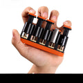 Grey and orange silicone finger trainer for hand strength, used for music practice and climbing.