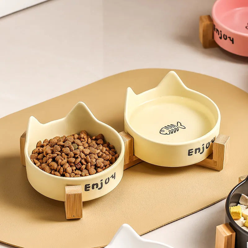 Porcelain cat bowl with wooden anti-tumble frame in cat ear design