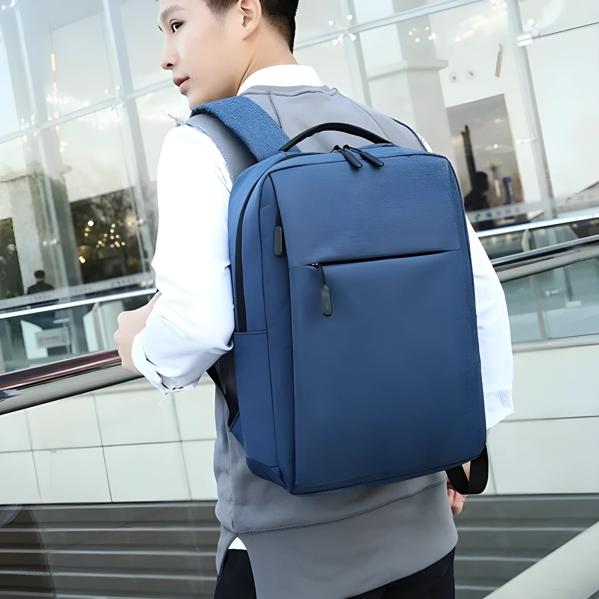 Large black sports backpack with USB charging port showing multiple compartments and curved shoulder straps
