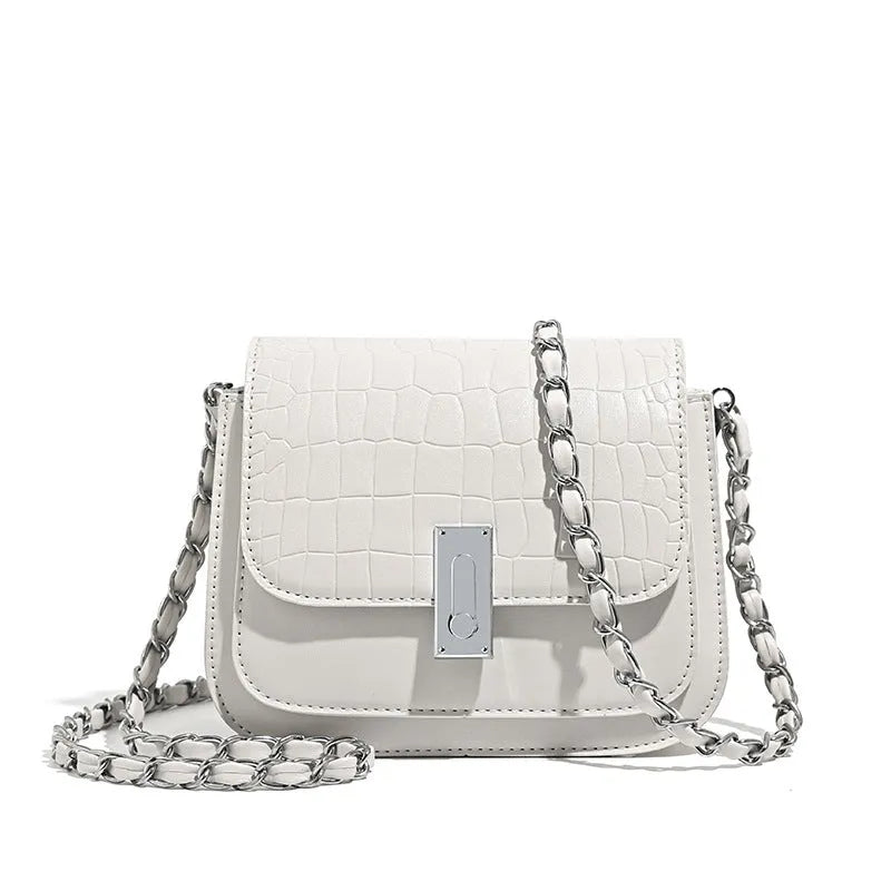 Soft PU women's fashion shoulder bag in horizontal square shape with phone compartment.