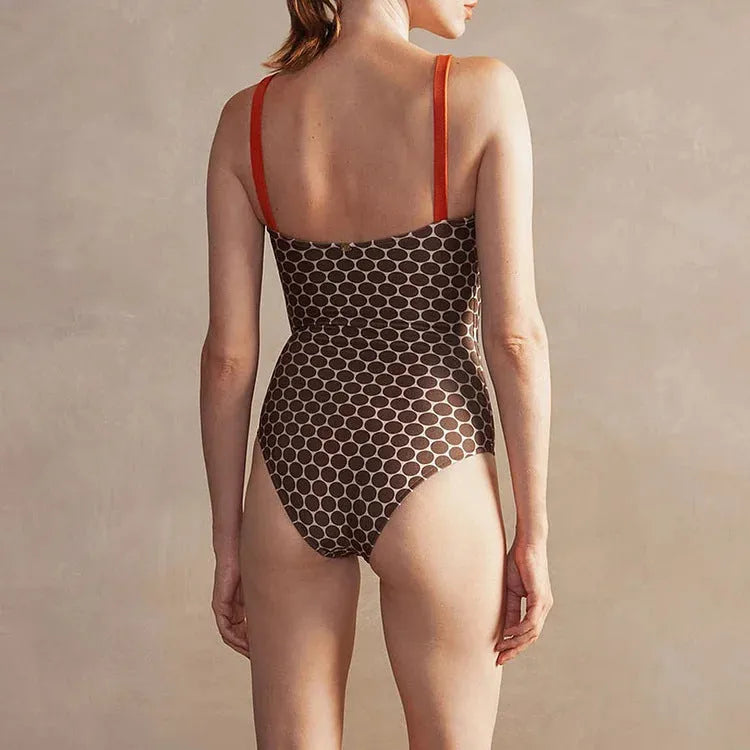 Women's one-piece swimsuit with matching wrap skirt in dot pattern design