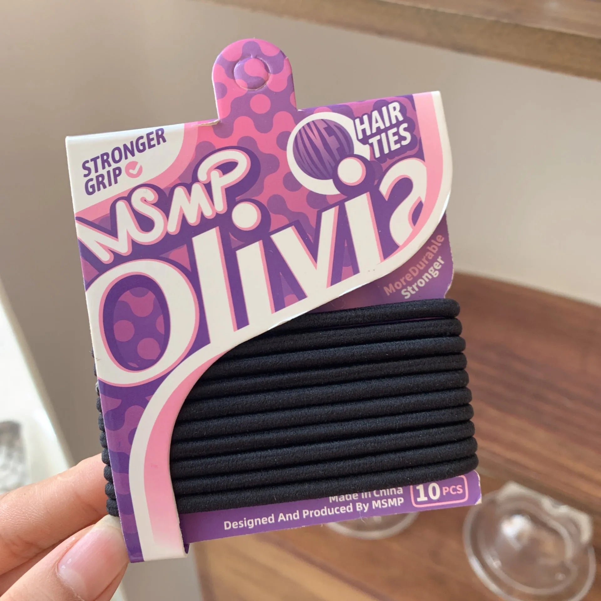 Candy colour elastic hair bands with braided design stretched to show length
