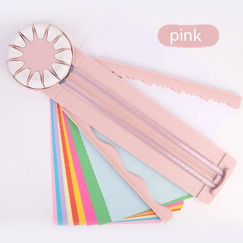 Pink plastic multifunctional 12-in-1 paper cutter and scoring board with size guides.