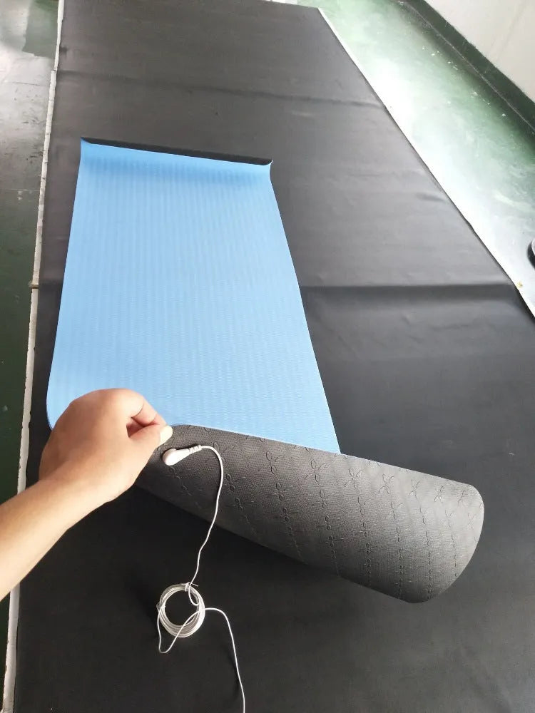 Blue conductive grounding yoga mat with plant pattern and integrated wire, measuring 182cm long.