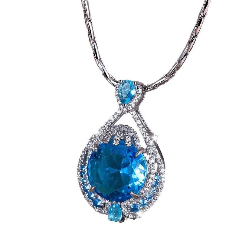 Blue geometric pendant necklace with fireworks cut crystal gemstone and water wave chain