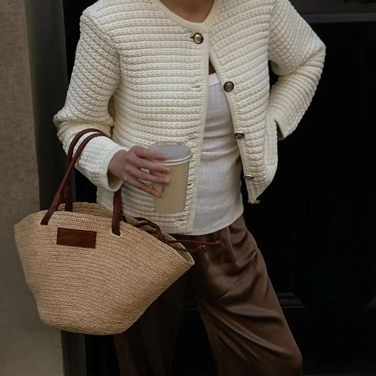 White women's long sleeve button shirt sweater made from polyester, front view