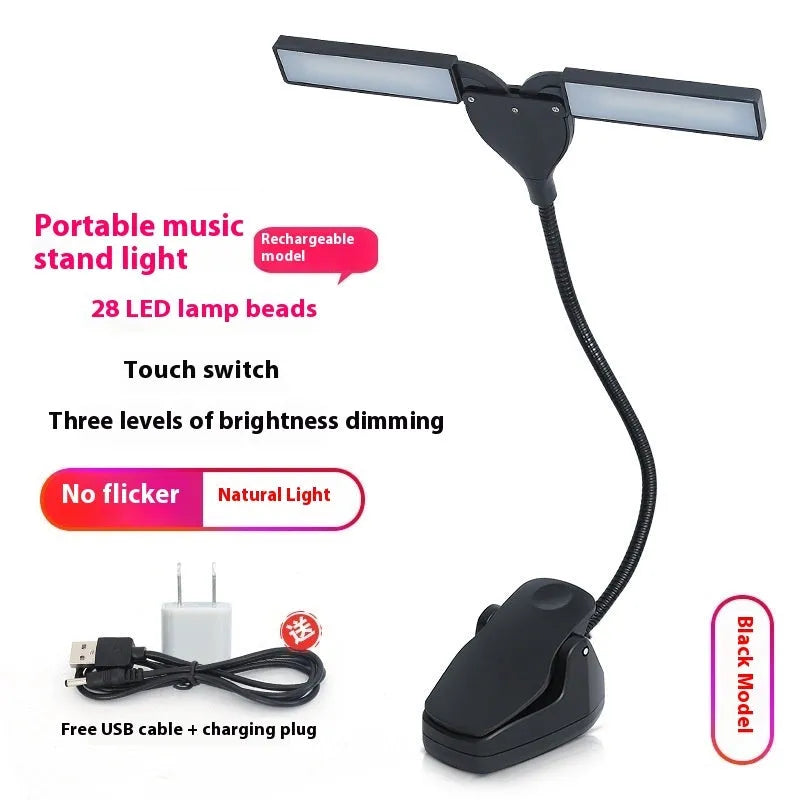 Black clip-on music stand lamp with 28 LEDs, shown with USB cable and AA batteries.