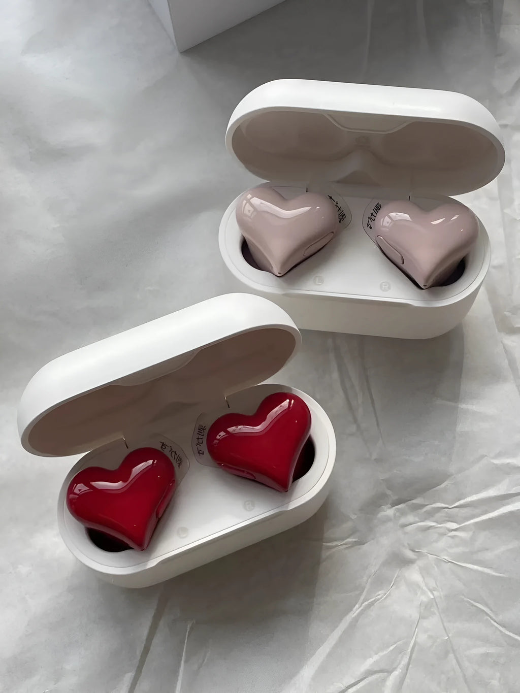 Heart-shaped wireless Bluetooth headphones in Chinese red colour with in-ear design