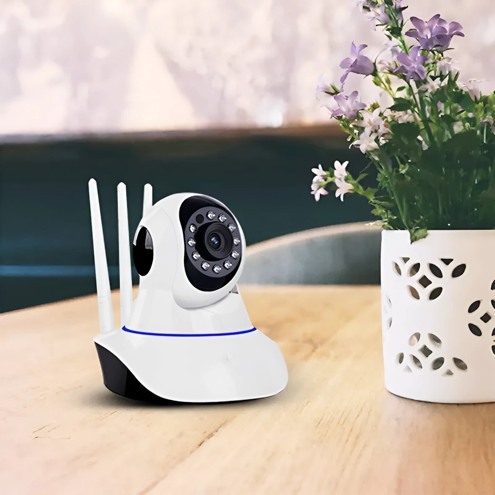 White dome-style wireless network camera with a 3.6mm lens for HD indoor and outdoor security.