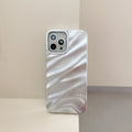 Soft solid colour wave pleated phone case for Apple iPhone 17 on a neutral background