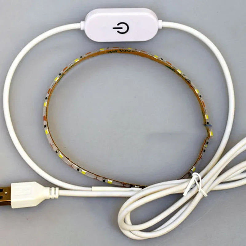 5 metre long flexible USB LED light strip showing touch control and bright white illumination