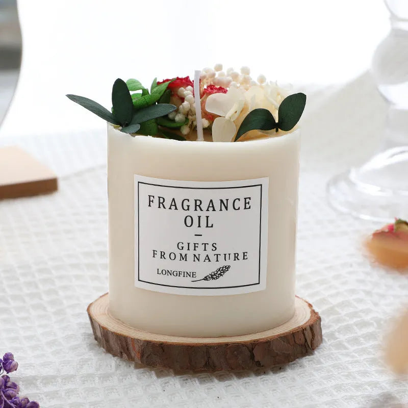 Decorative dried flower candle in jar with wooden chip base, available in nine botanical scents