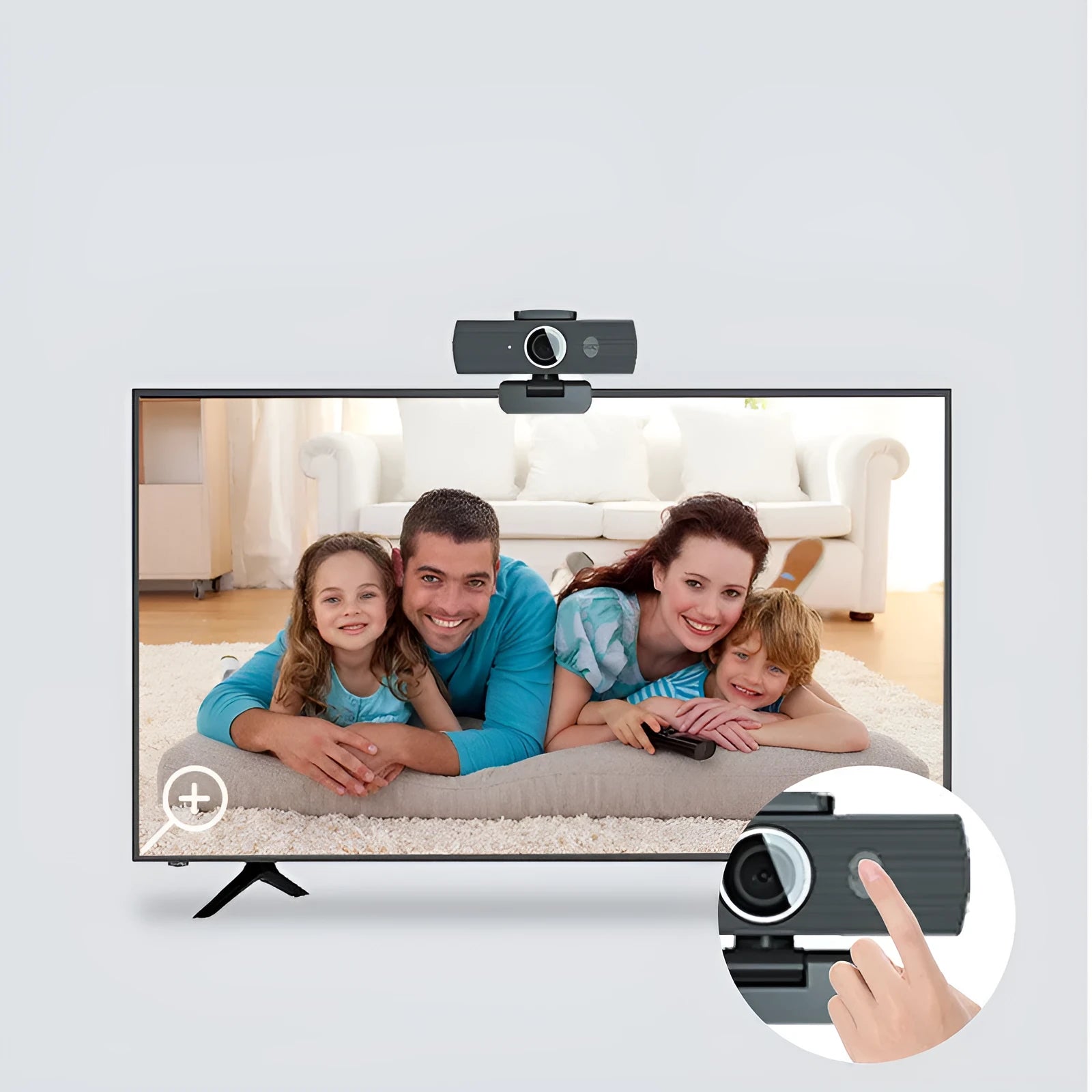 Black ABS plastic USB computer webcam with a detached magnetic privacy cover on a desk.